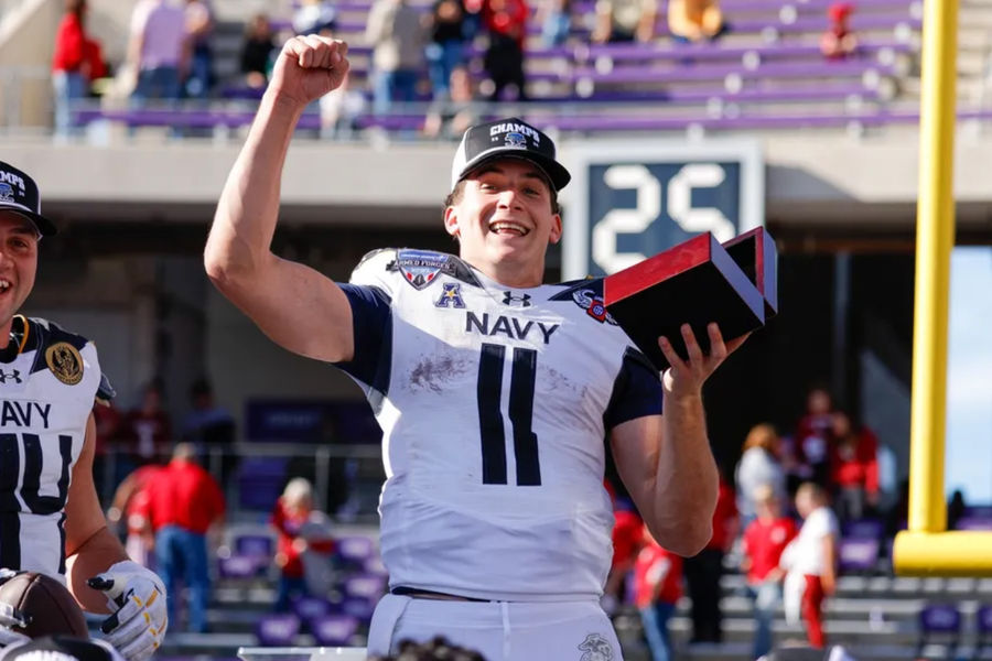 December 27, 2024; Fort Worth, TX, USA; Navy Midshipmen Quarterback Blake Horvath (11) celebrates winning MVP after the match against Oklahoma Sooners at Amon G. Carter Stadium. Mandatory Credit: Andrew Dieb-Imagn images