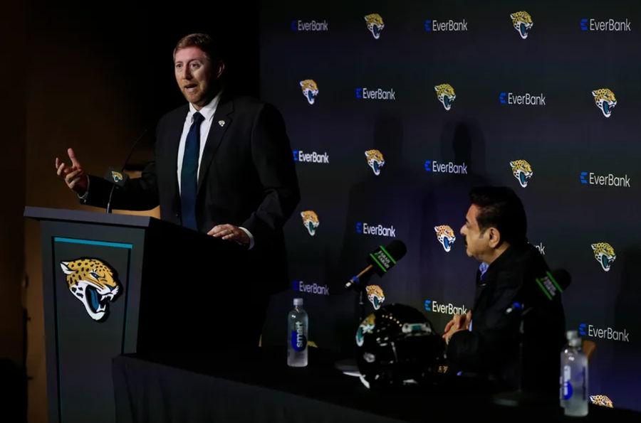 New Jacksonville Jaguar's head coach Liam Coen speaks when Jaguar's owner Shad Khan looks at during a press conference on Monday 27 January 2025 at the Miller Electric Center in Jacksonville, FLA. [Corey Perrine/Florida Times-Union]
