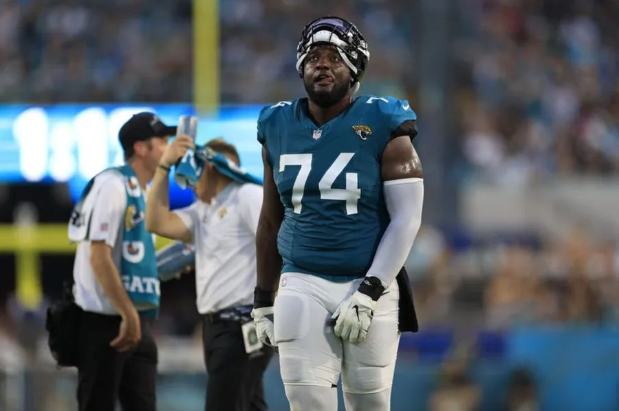 Jacksonville Jaguar's offensive tackle Cam Robinson (74) responds to a catch that is confirmed in favor of Jacksonville Jaguars during the second quarter of a matchup for the preseason on Saturday August 26, 2023 at Everbank Stadium in Jacksonville, FLA. [Corey Perrine/Florida Times-Union] Credits: Corey Perrine / USA Today Network