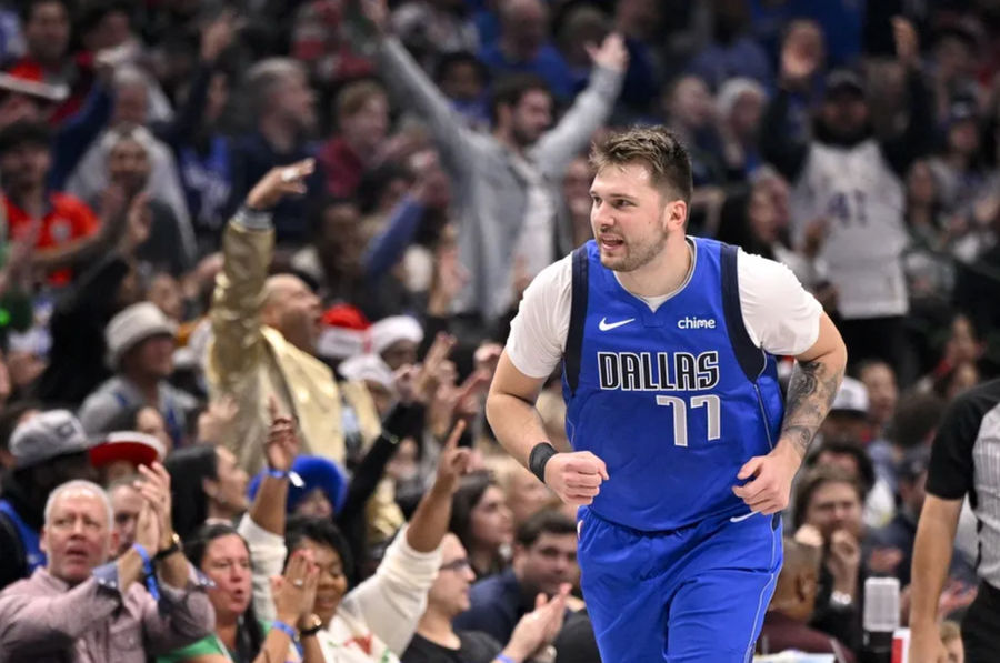 December 25, 2024; Dallas, Texas, USA; Dallas Maverick's guard Luka Doncic (77) celebrates after making a basket against the Minnesota Timberwolves during the first quarter at the American Airlines Center. Mandatory Credit: Jerome Miron-Imagn Pictures