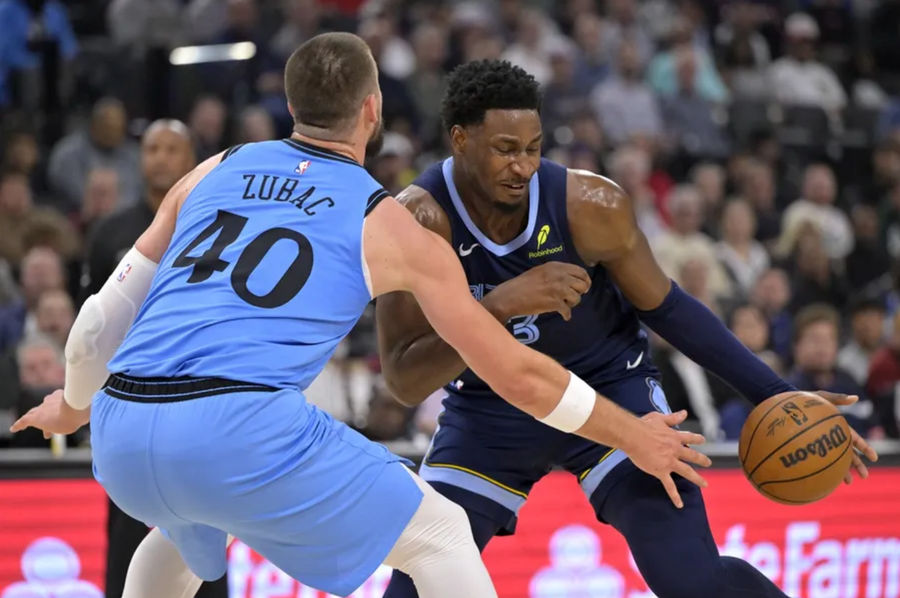 March 21, 2025; Ingrlewood, California, USA; Memphis Grizzlies forward Jaren Jackson Jr. (13) Drive past the Los Angeles Clippers Center Ivica Zubac (40) during the first half on Intuit Dome. Mandatory Credit: Jayne Kamin-Oncea-Imagn Pictures