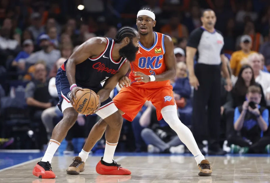 November 11, 2024; Oklahoma City, Oklahoma, USA; Oklahoma City Thunder Guard Shai Gilgeous-Alexander (2) defends a unit of Los Angeles Clippers Guard James Harden (1) during the second quarter at the Paycom Center. Mandatory Credit: Alonzo Adams-Imagn Pictures