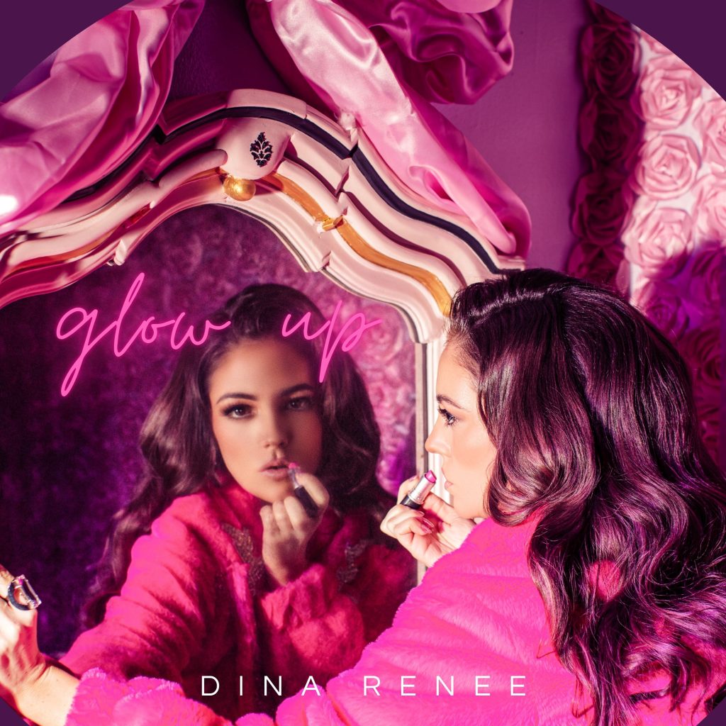 Your renée poses in front of a mirror that bears pink and reflects the confidence and femininity in her new single "Glow up."

